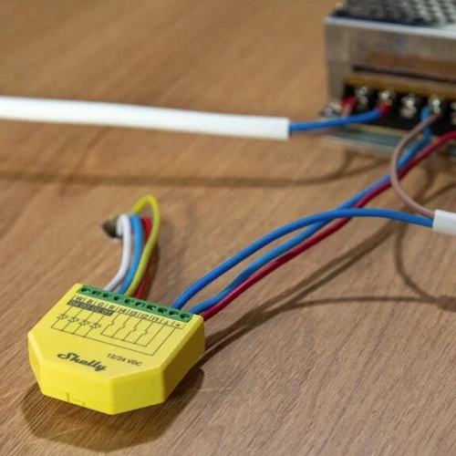 Shelly Plus RGBW PM yellow smart LED controller for RGBW strips front view